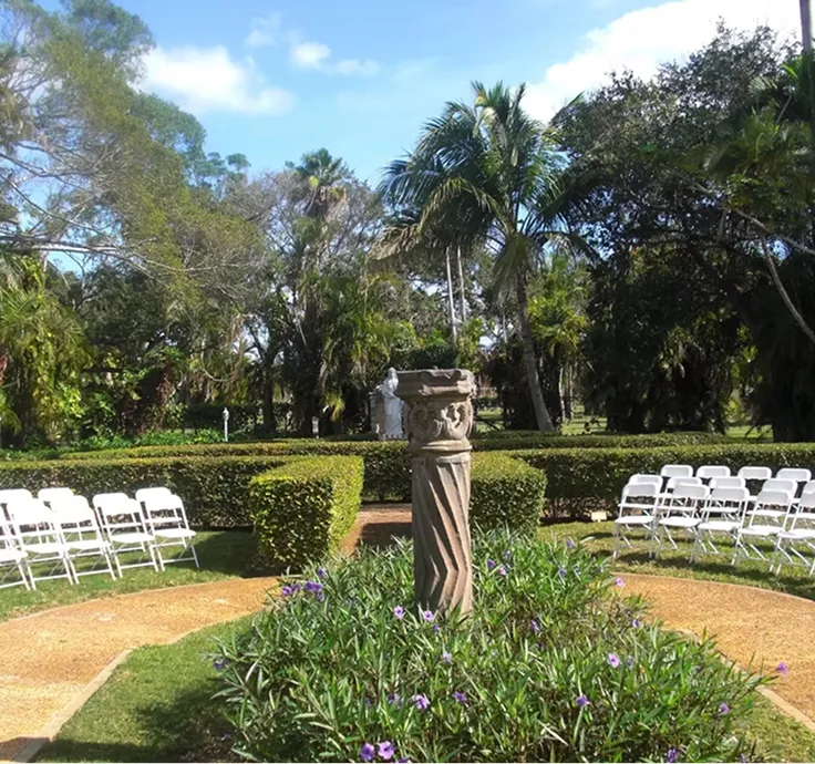 Interior view of Coral Gables Country Club with a bar, a dance floor, and a stage