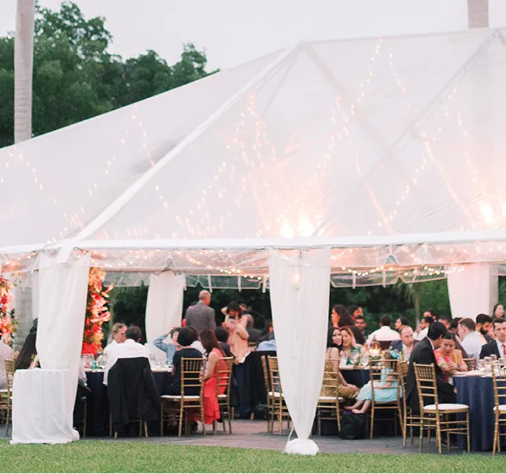 Interior view of Deering Estate with a bar, a dance floor, and a stage