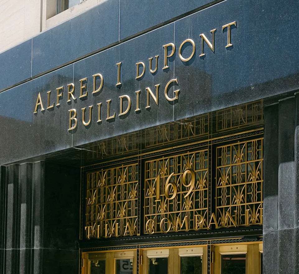 Alfred I. duPont Building with lush tropical greenery and a beautiful view of the gardens