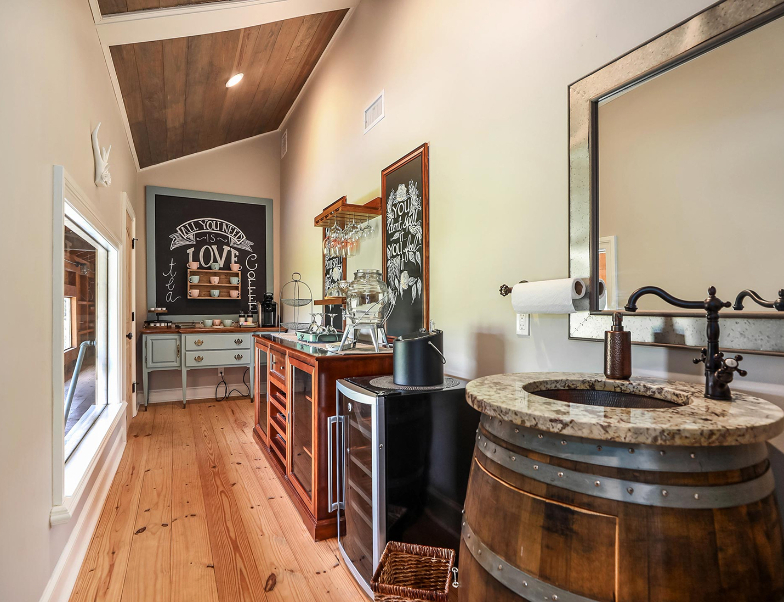 Outdoor fire pit area surrounded by natural beauty and towering pine trees