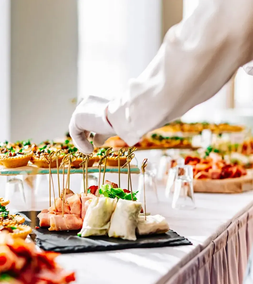 Elegant catering table with assorted appetizers and finger foods arranged for a wedding reception
